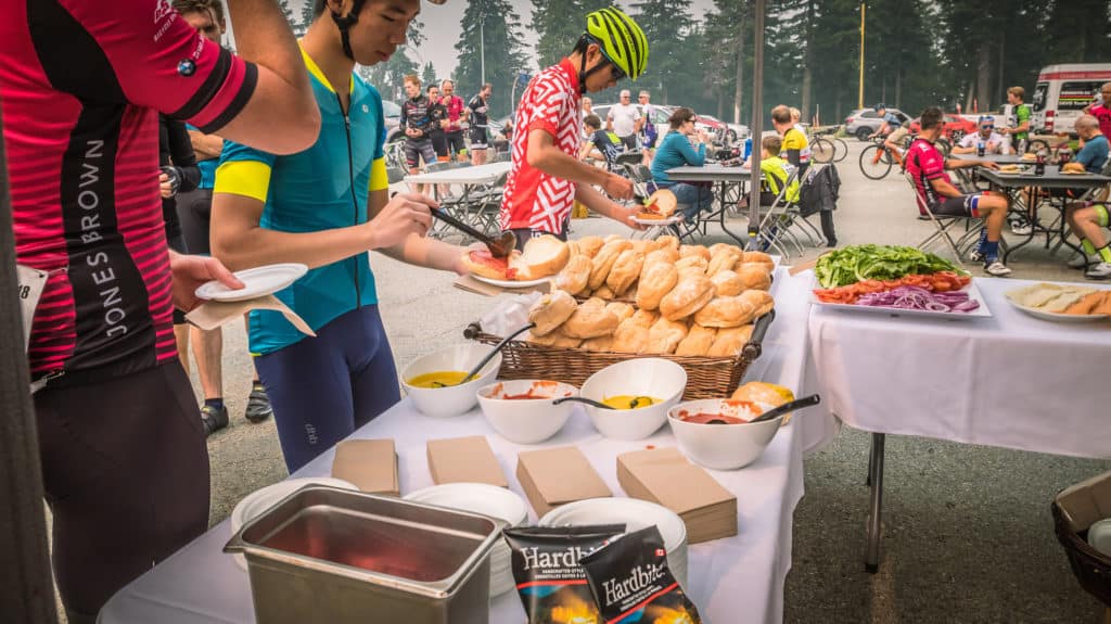 Cyclists at the top enjoying BBQ food