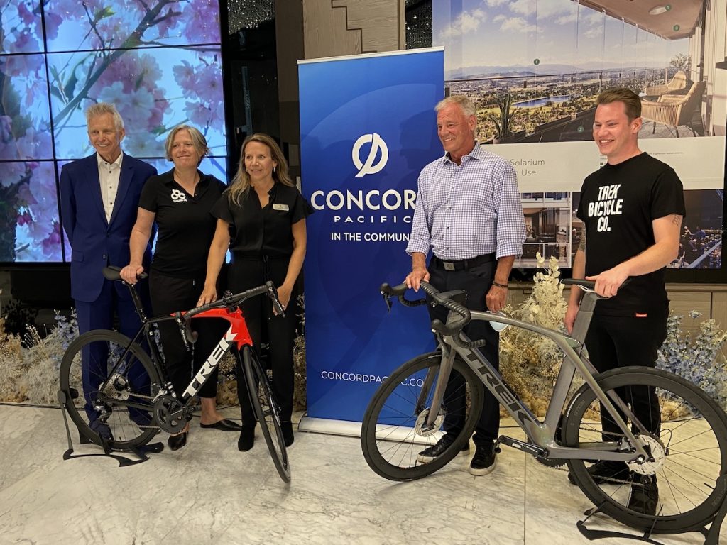Cycling BC CEO, Erin Waugh (second from the left) poses for a photo with the Concord Pacific team and a representative from event sponsor Trek Bicycles at a press event.