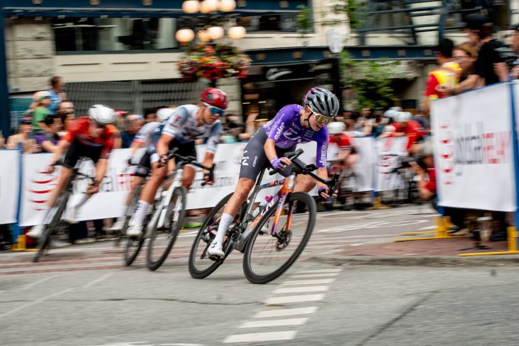 Women riders rounding a corner